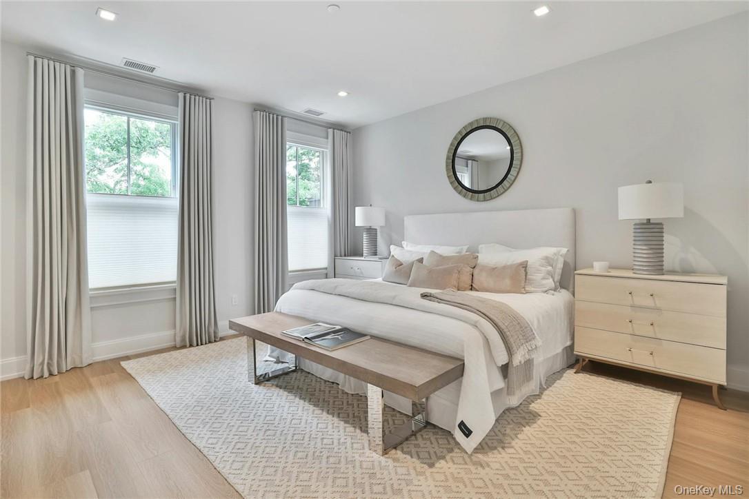 162 Bedford Road, Unit 16 Armonk, NY 10504 - Photo 10 of 37 a bedroom with a bed and a window