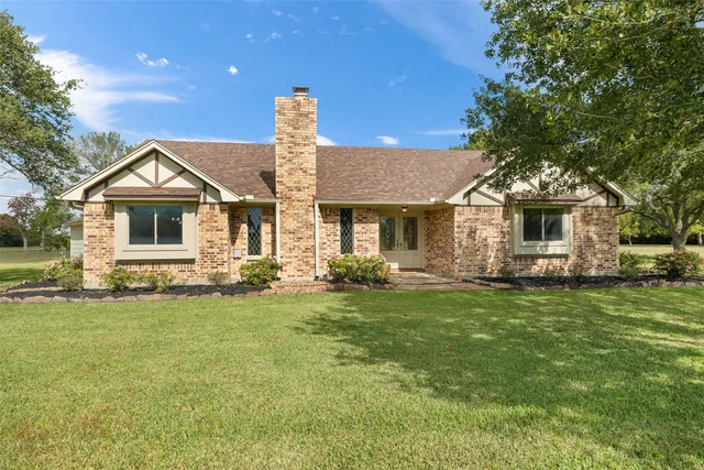 a swimming pool with trees in the background