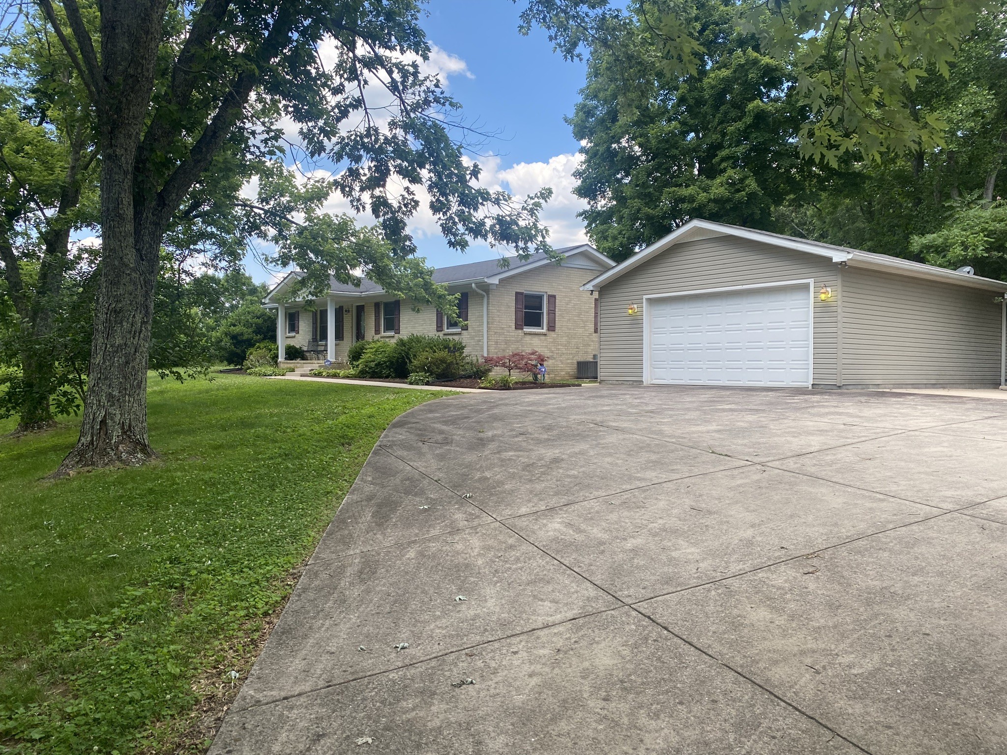 818 Dale Ridge Road Dowelltown, TN 37059 - Photo 2 of 24 a view of a house with a yard and large trees