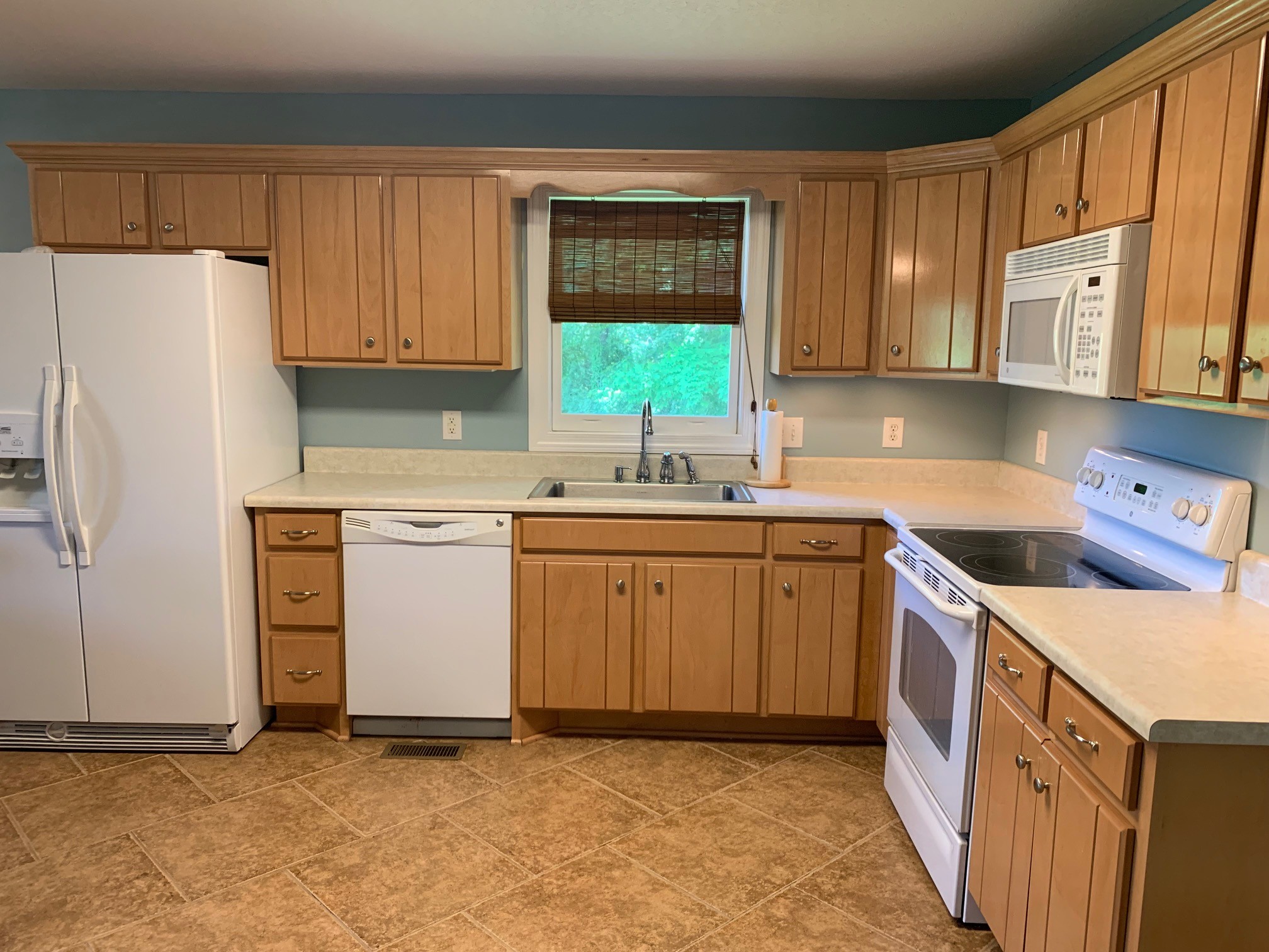 818 Dale Ridge Road Dowelltown, TN 37059 - Photo 6 of 24 a kitchen with a sink stove and cabinets