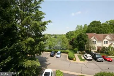 a view of a patio with table and chairs and potted plants