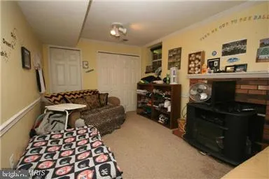 a living room with furniture rug and window