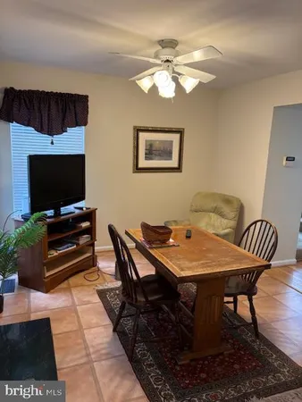 a living room with a couch and a flat screen tv
