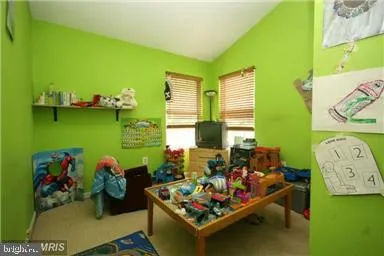 a living room with furniture and garden view