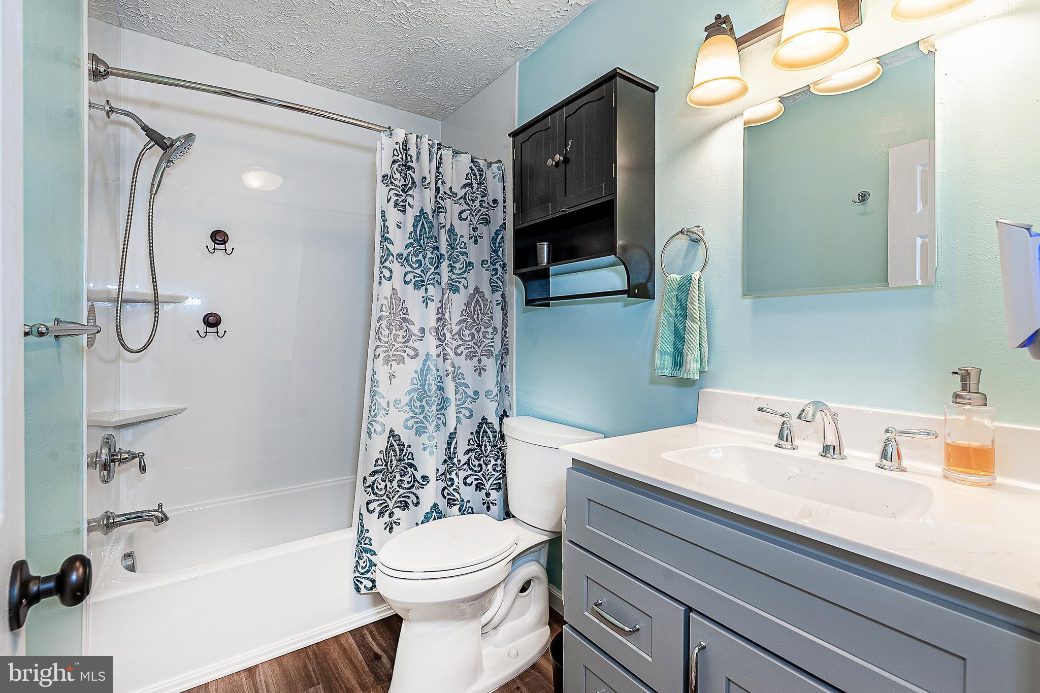 41 Noble Road Sicklerville, NJ 08081 - Photo 12 of 18 a bathroom with a sink a toilet and shower