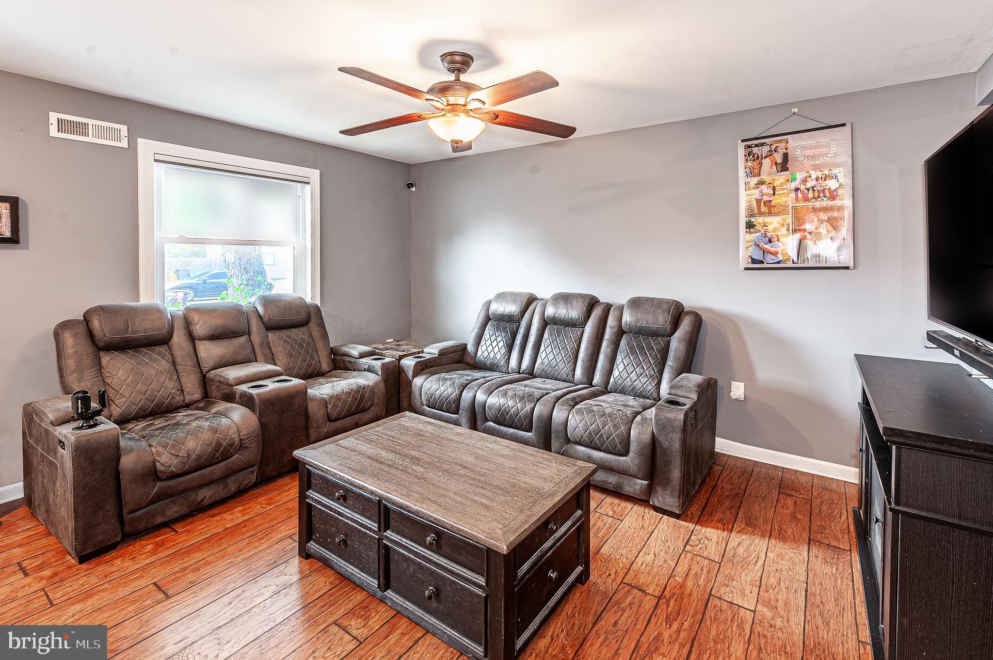 41 Noble Road Sicklerville, NJ 08081 - Photo 3 of 18 a living room with furniture a flat screen tv and a window