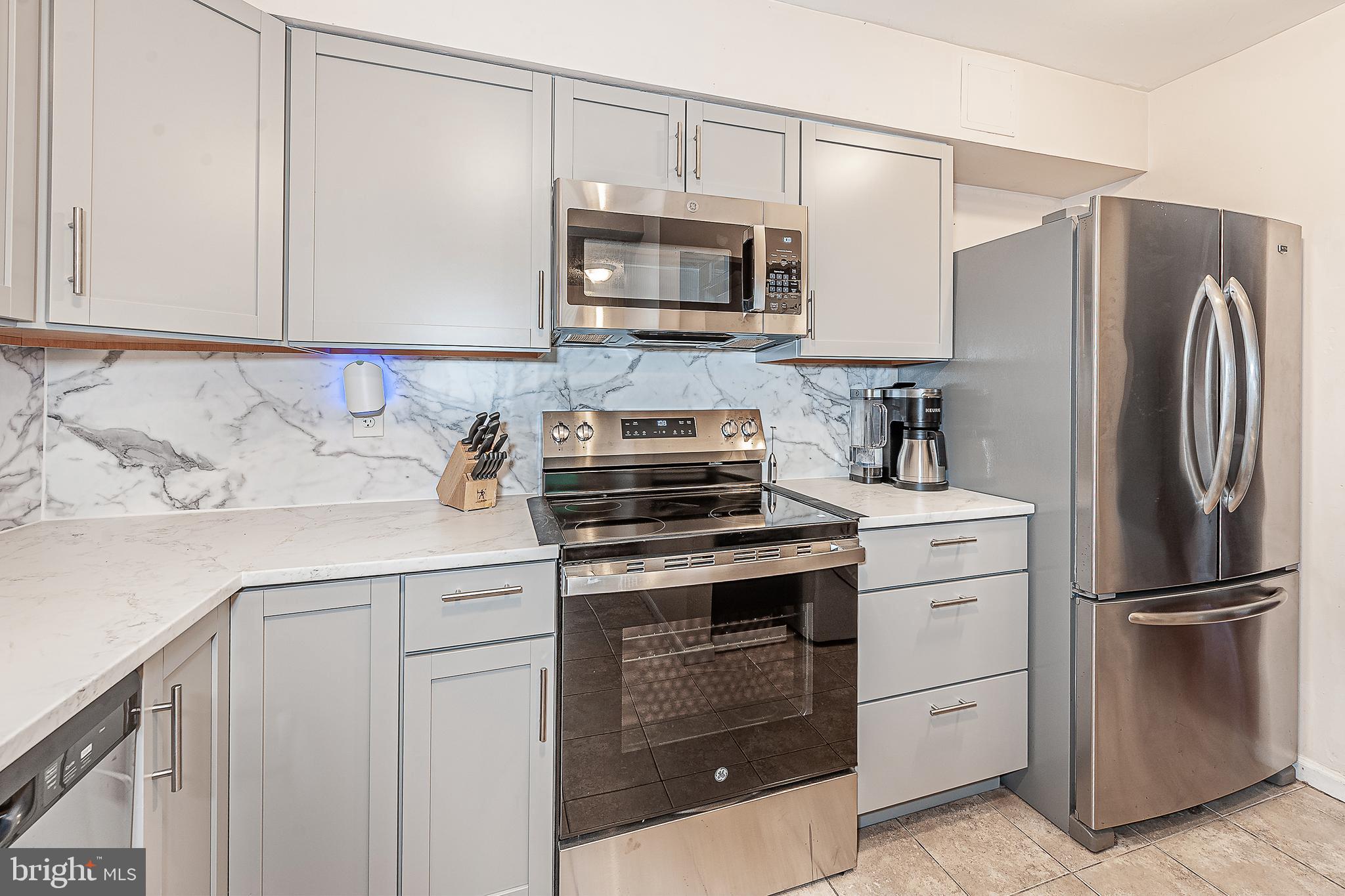 41 Noble Road Sicklerville, NJ 08081 - Photo 6 of 18 a kitchen with appliances a sink and cabinets