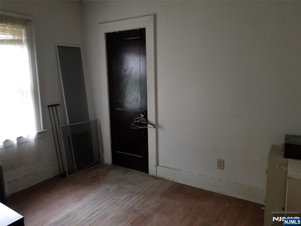 734 Broad Street Bloomfield, NJ 07003 - Photo 19 of 23 an empty room with wooden floor and closet