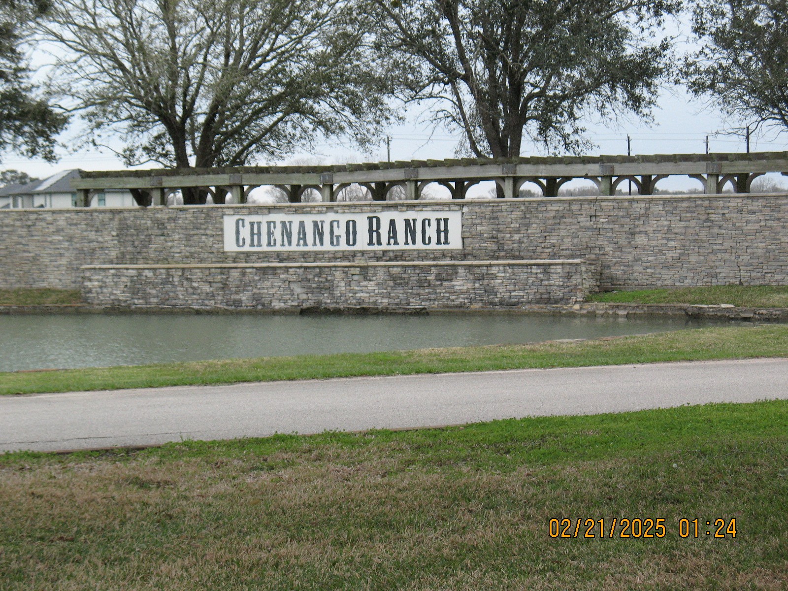 a view of a park with a bench and trees