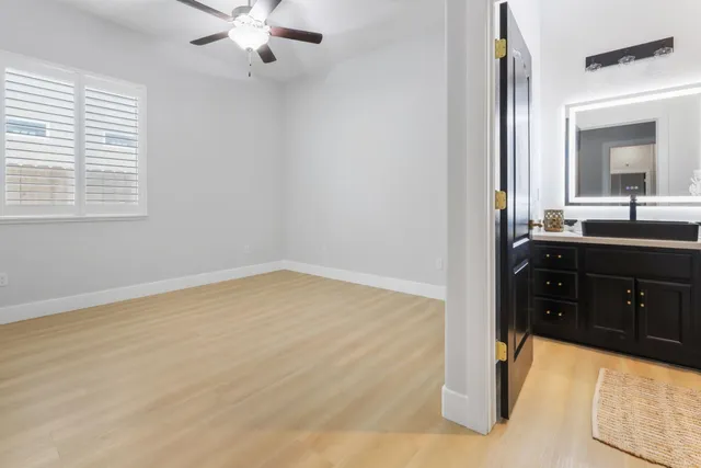 a bathroom with a sink vanity and mirror