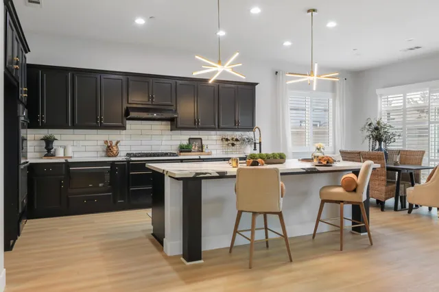 a kitchen with a sink cabinets and window