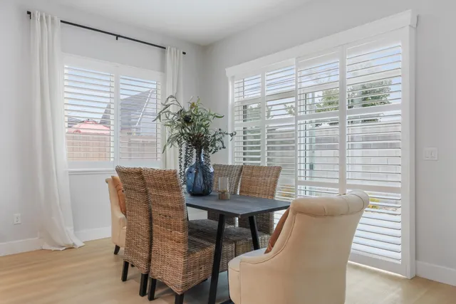 a dining room with furniture and window