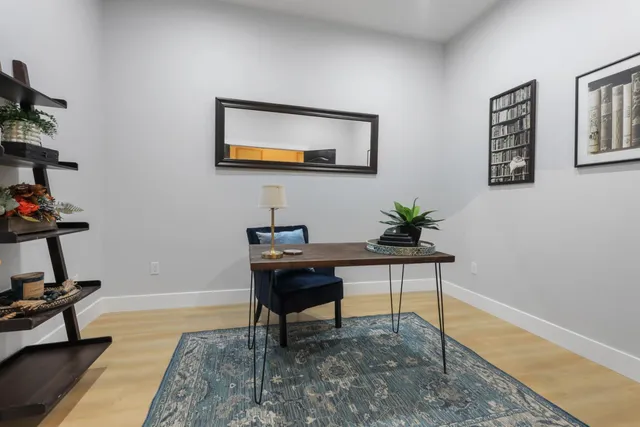 a view of a workspace with furniture