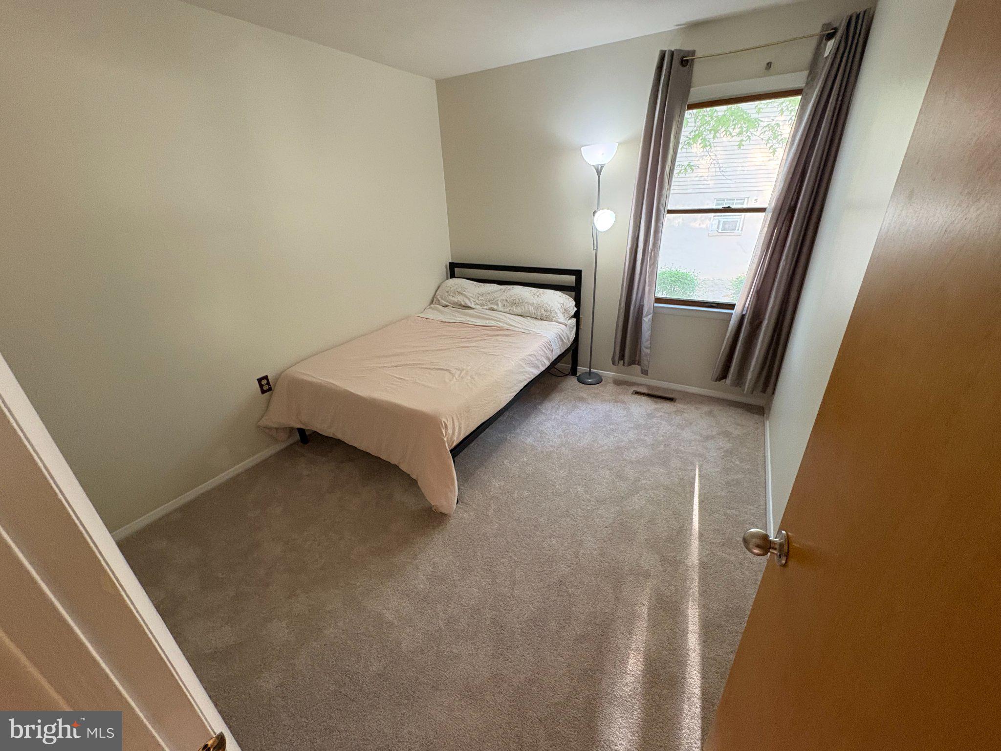 303 Boxford Court Frederick, MD 21702 - Photo 11 of 20 Cozy bedroom with natural light.
