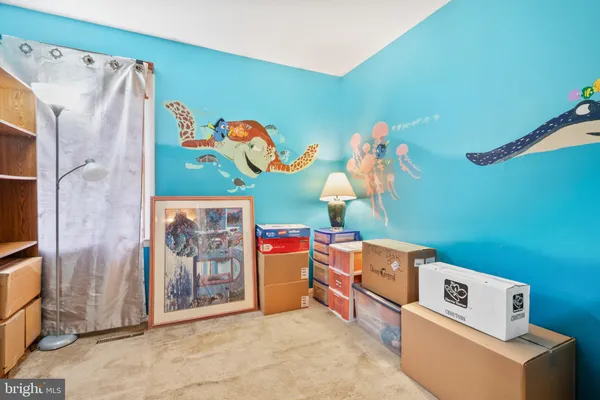 a bedroom with a bed next to a window with the outer view