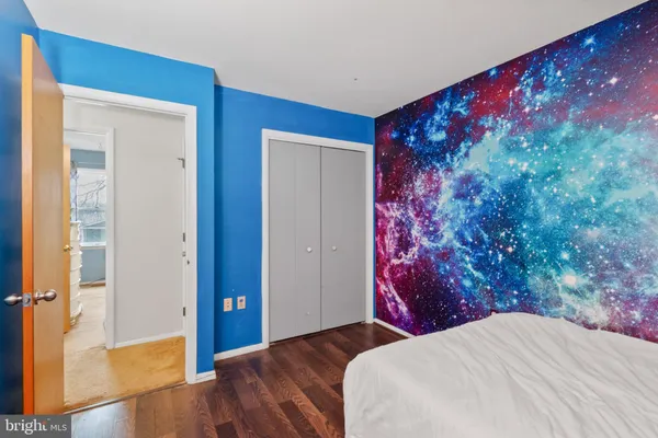 a bathroom with a sink a toilet and shower curtain