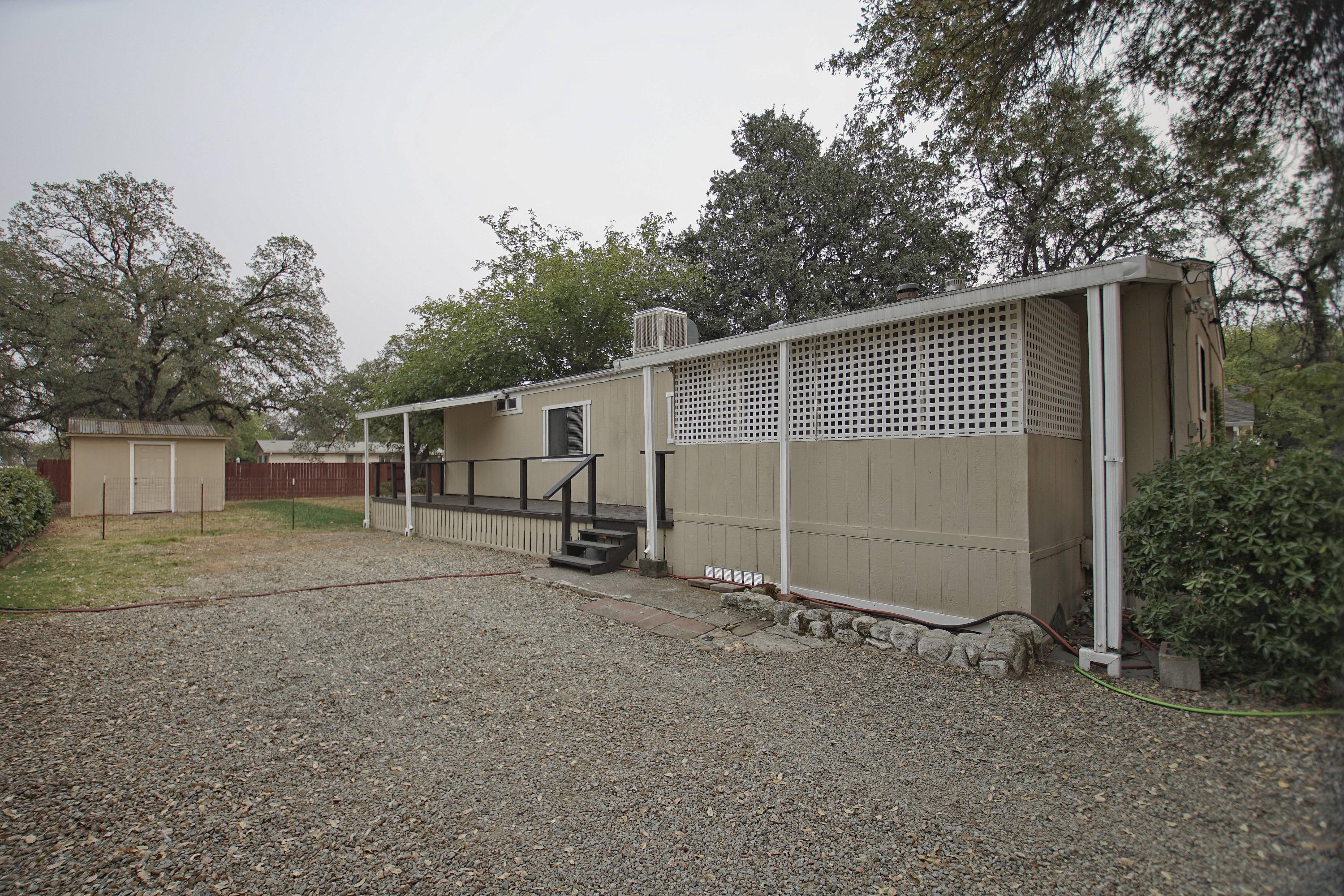 11831 Scott Road Redding, CA 96003 - Photo 1 of 22 a view of a house with backyard and trees