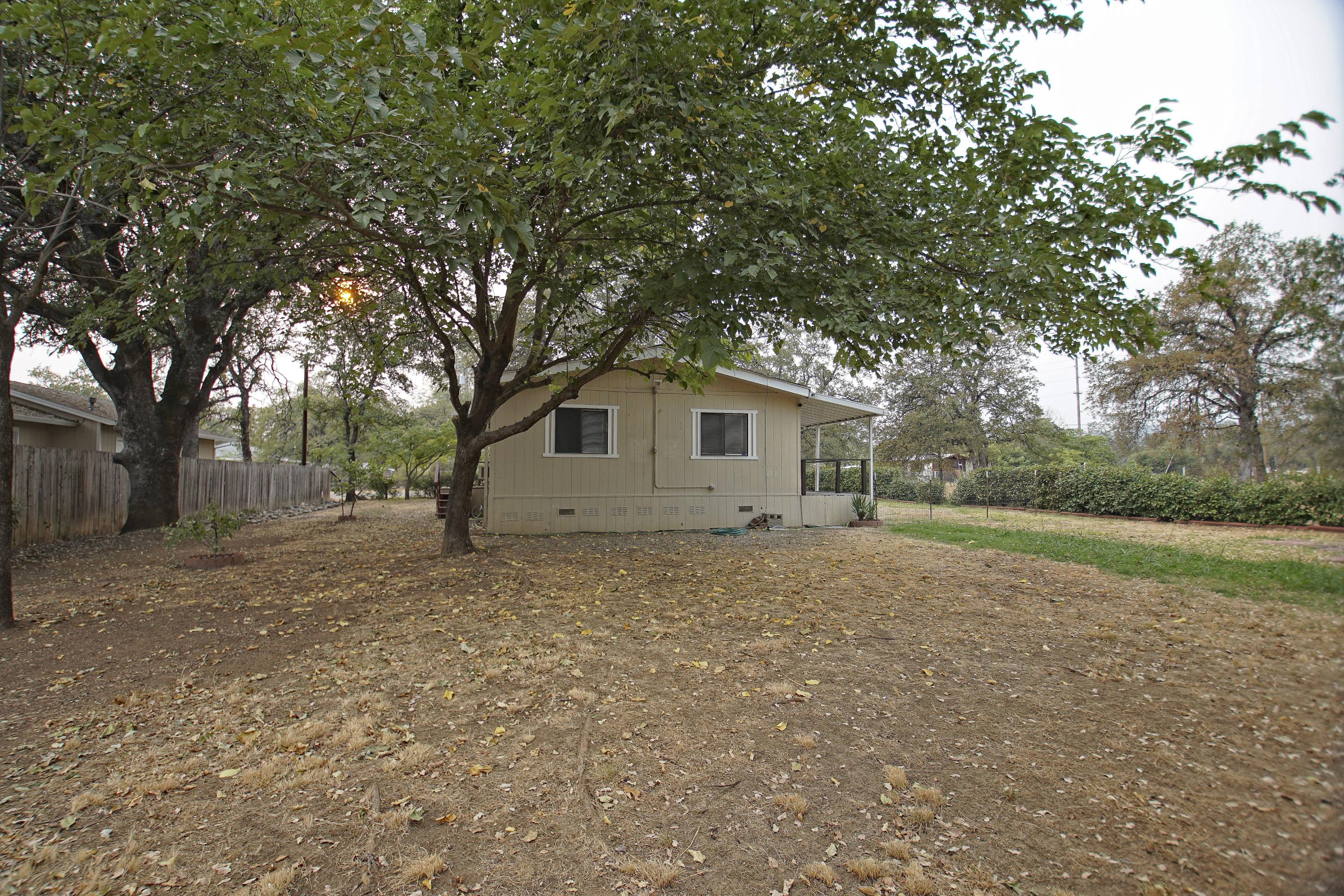11831 Scott Road Redding, CA 96003 - Photo 20 of 22 a view of a house with a backyard