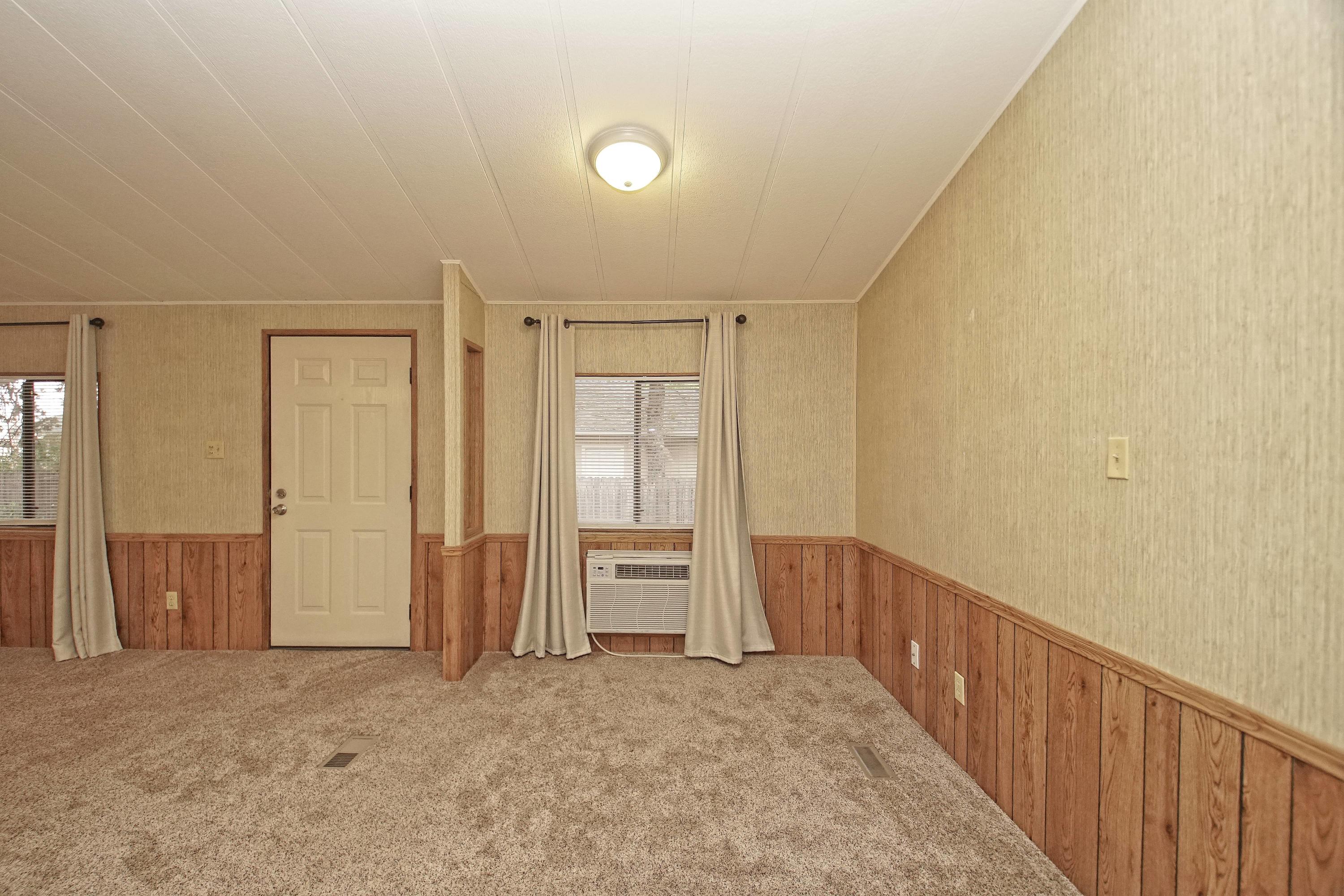 11831 Scott Road Redding, CA 96003 - Photo 9 of 22 a view of an empty room with wooden floor