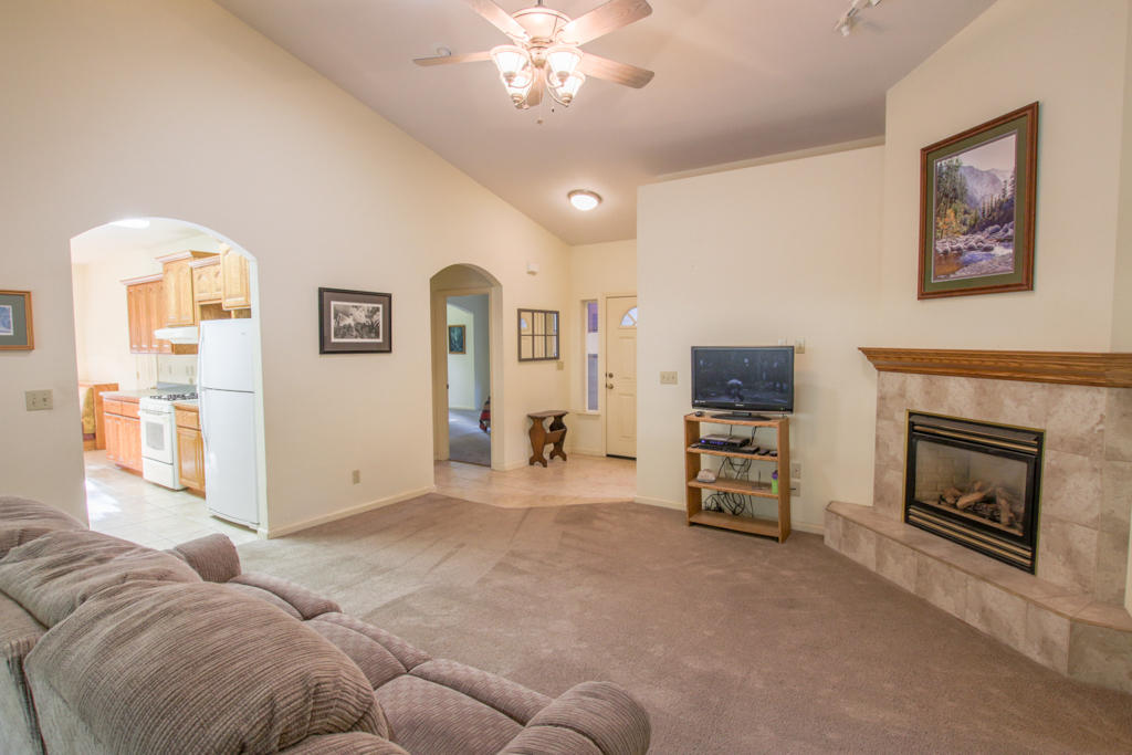 12855 Fern Road Whitmore, CA 96096 - Photo 2 of 45 a living room with furniture and a fireplace