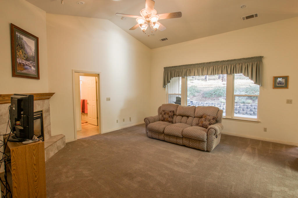 12855 Fern Road Whitmore, CA 96096 - Photo 3 of 45 a living room with furniture and a flat screen tv