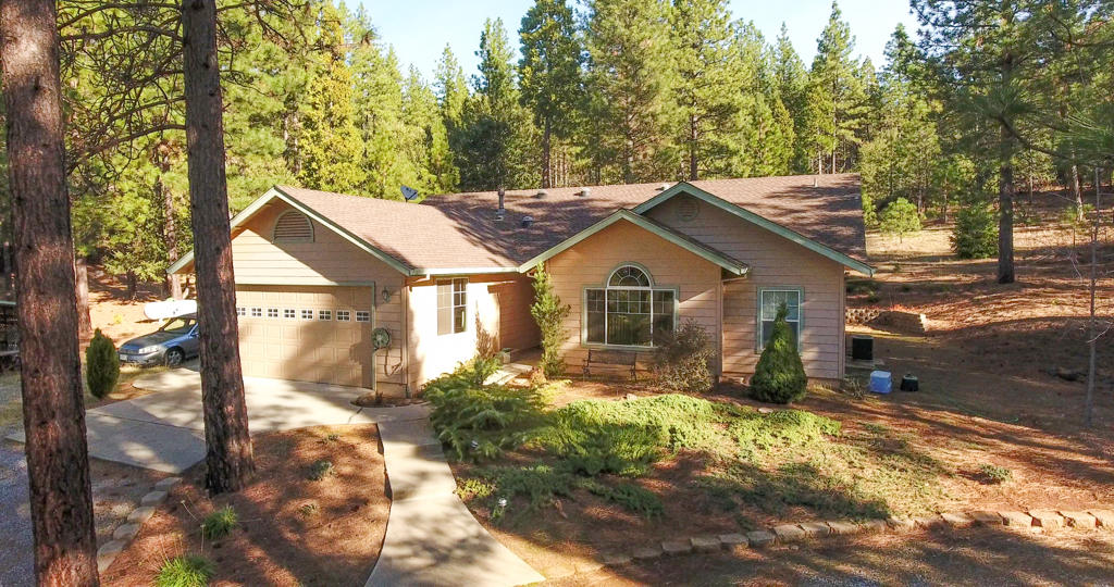 12855 Fern Road Whitmore, CA 96096 - Photo 41 of 45 a view of a house with yard and covered in the middle