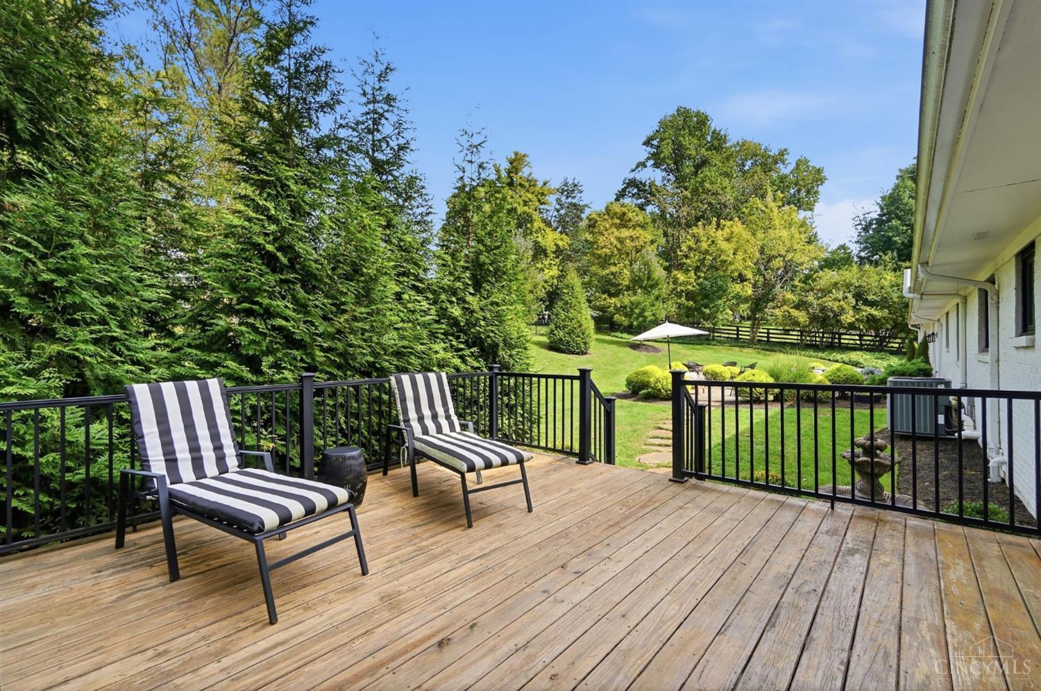 2430 Section Road Amberley, OH 45237 - Photo 30 of 81 Expansive deck connecting lush and private grounds.