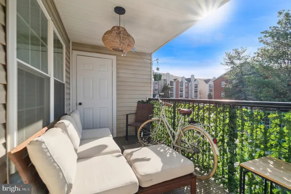 a view of a balcony with furniture