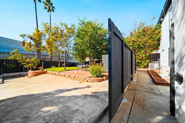 a view of a backyard of the house