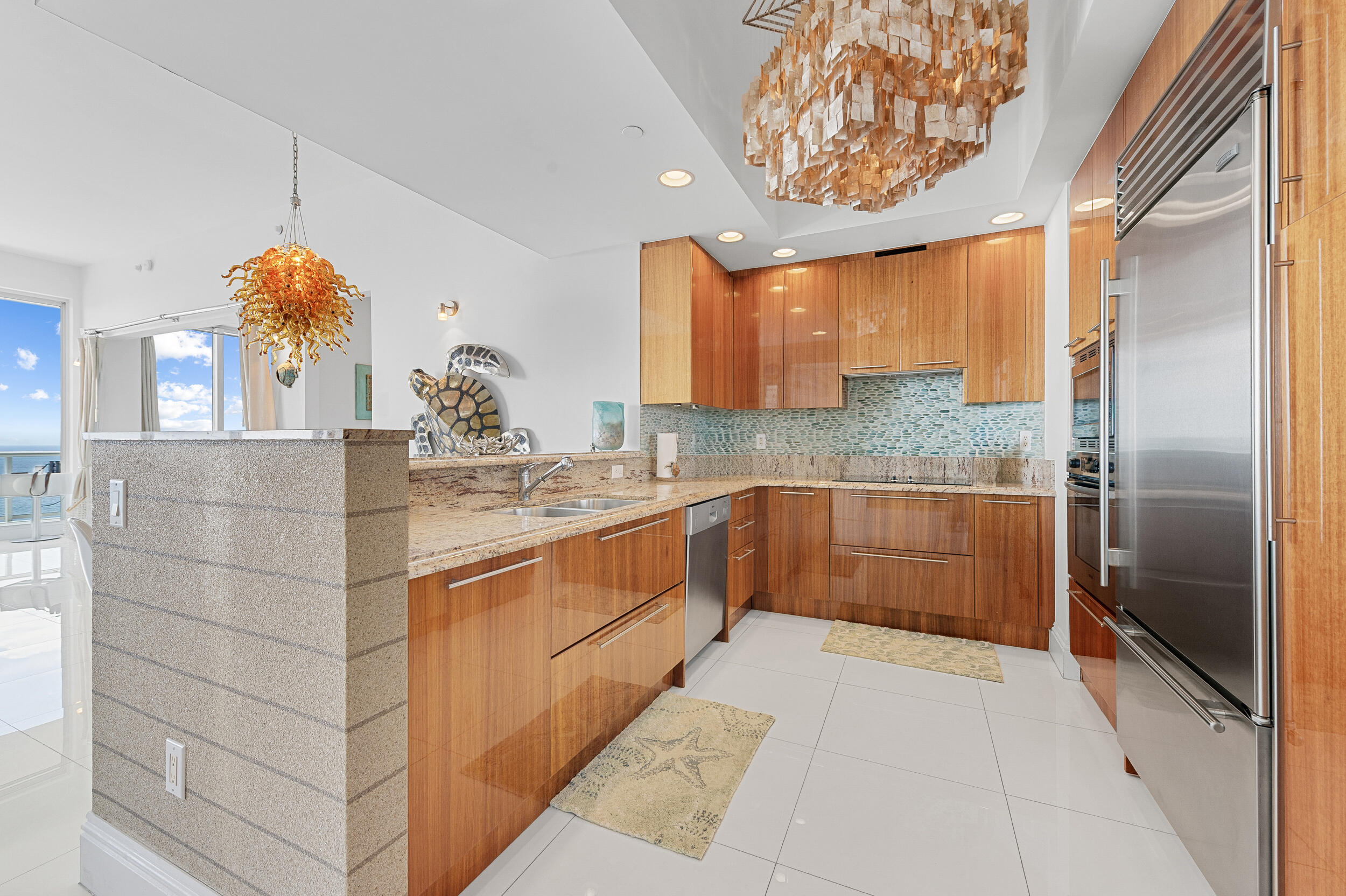 2700 North Ocean Drive, Unit PH4B Singer Island, FL 33404 - Photo 4 of 25 a kitchen with a sink and cabinets