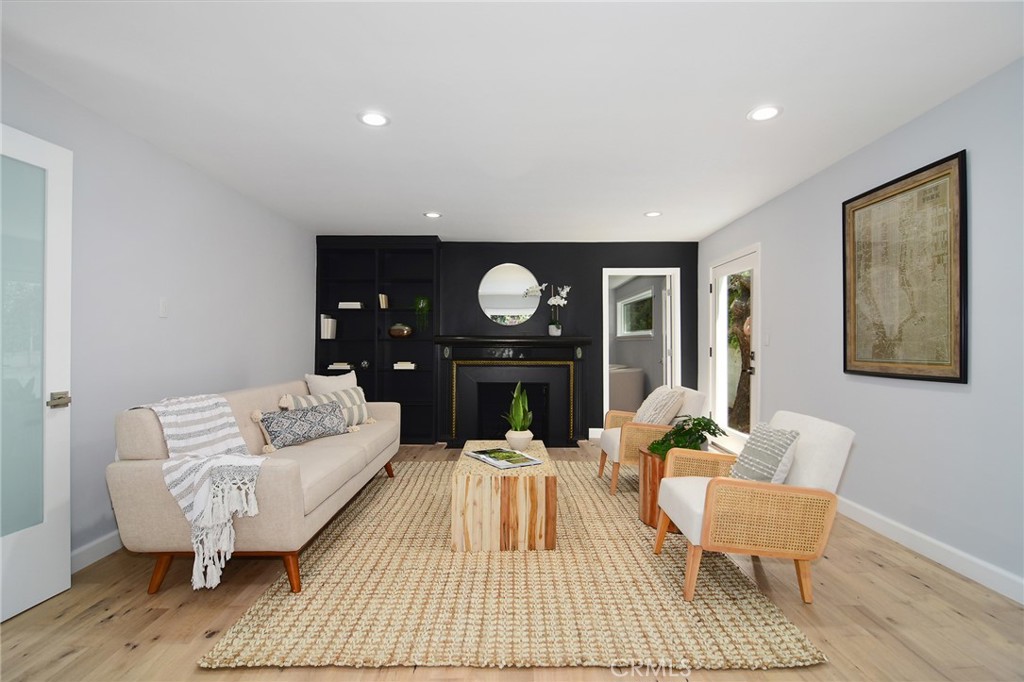 12427 Sunset Boulevard Los Angeles, CA 90049 - Photo 11 of 58 a living room with furniture and wooden floor