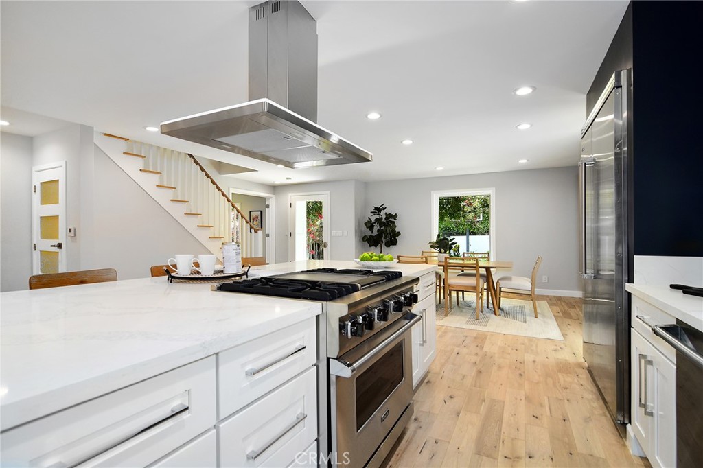 12427 Sunset Boulevard Los Angeles, CA 90049 - Photo 18 of 58 a kitchen with stove and cabinets