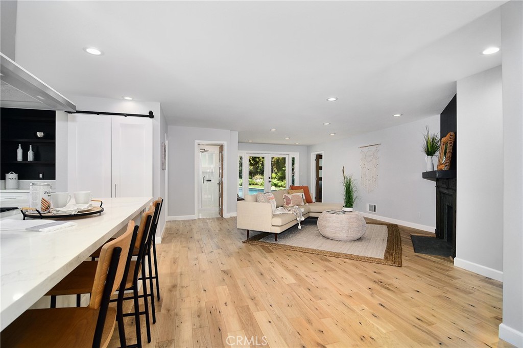 12427 Sunset Boulevard Los Angeles, CA 90049 - Photo 23 of 58 a living room with furniture and wooden floor