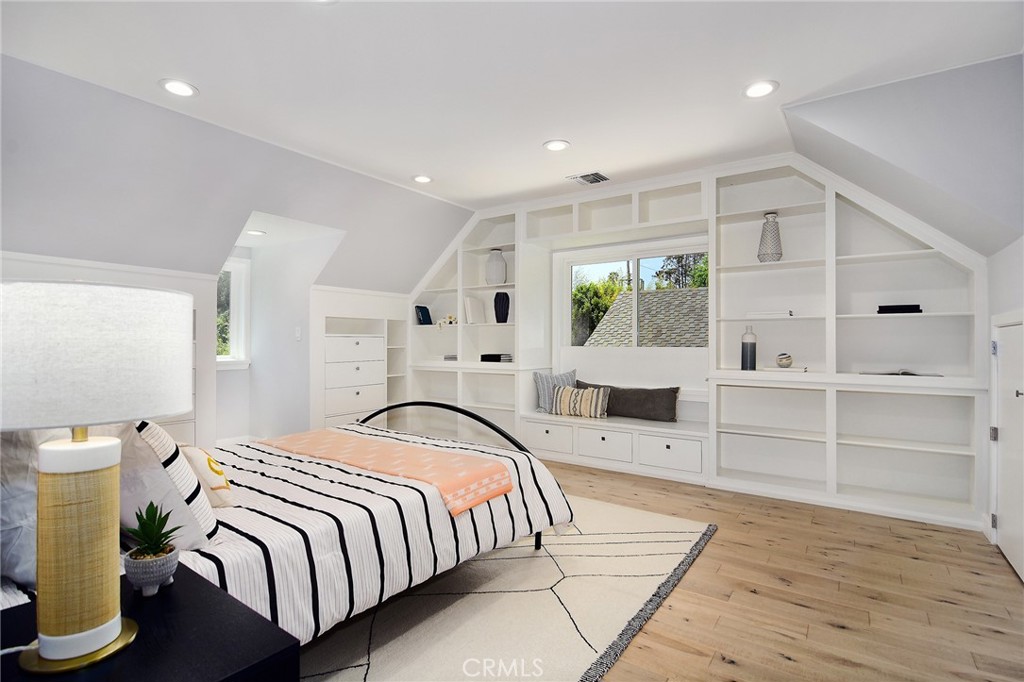 12427 Sunset Boulevard Los Angeles, CA 90049 - Photo 37 of 58 a bedroom with a bed and a window