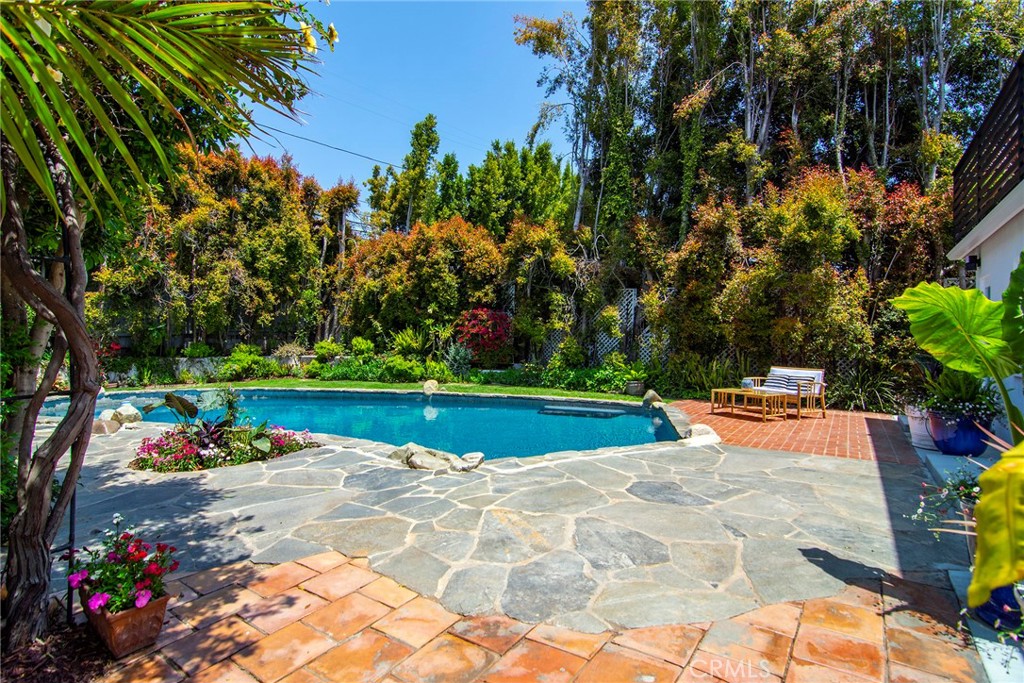 12427 Sunset Boulevard Los Angeles, CA 90049 - Photo 47 of 58 a view of a swimming pool with an outdoor space and seating area