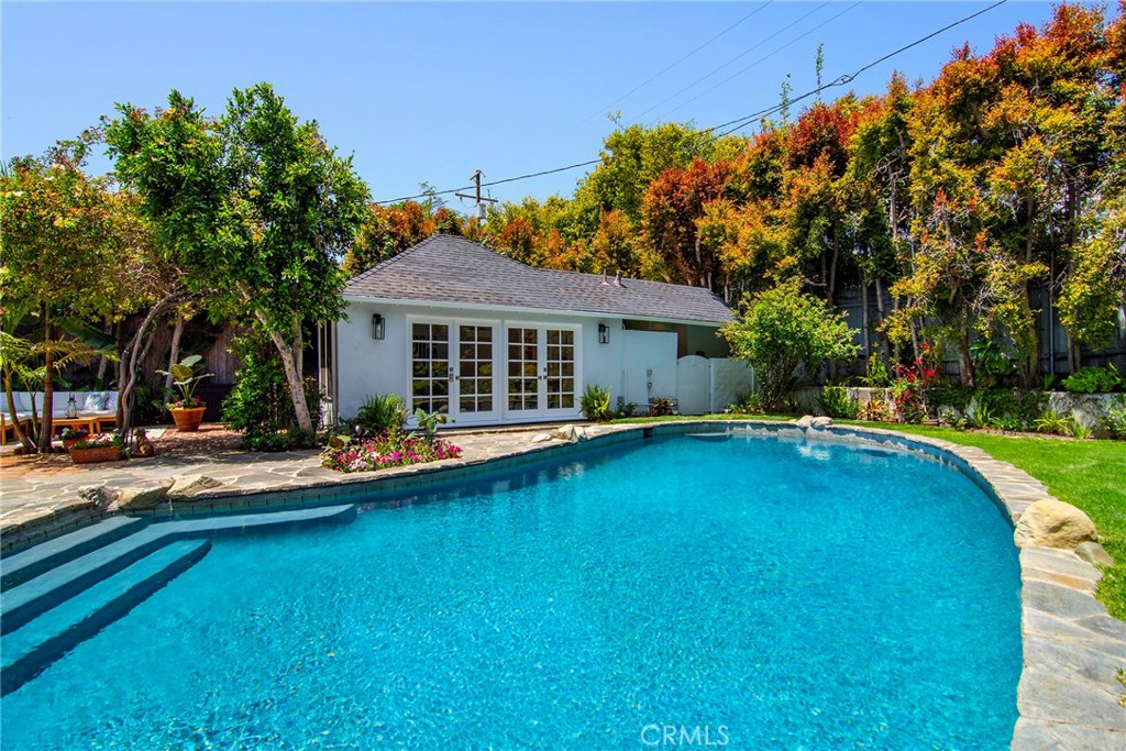 12427 Sunset Boulevard Los Angeles, CA 90049 - Photo 49 of 58 a front view of a house with swimming pool having outdoor seating