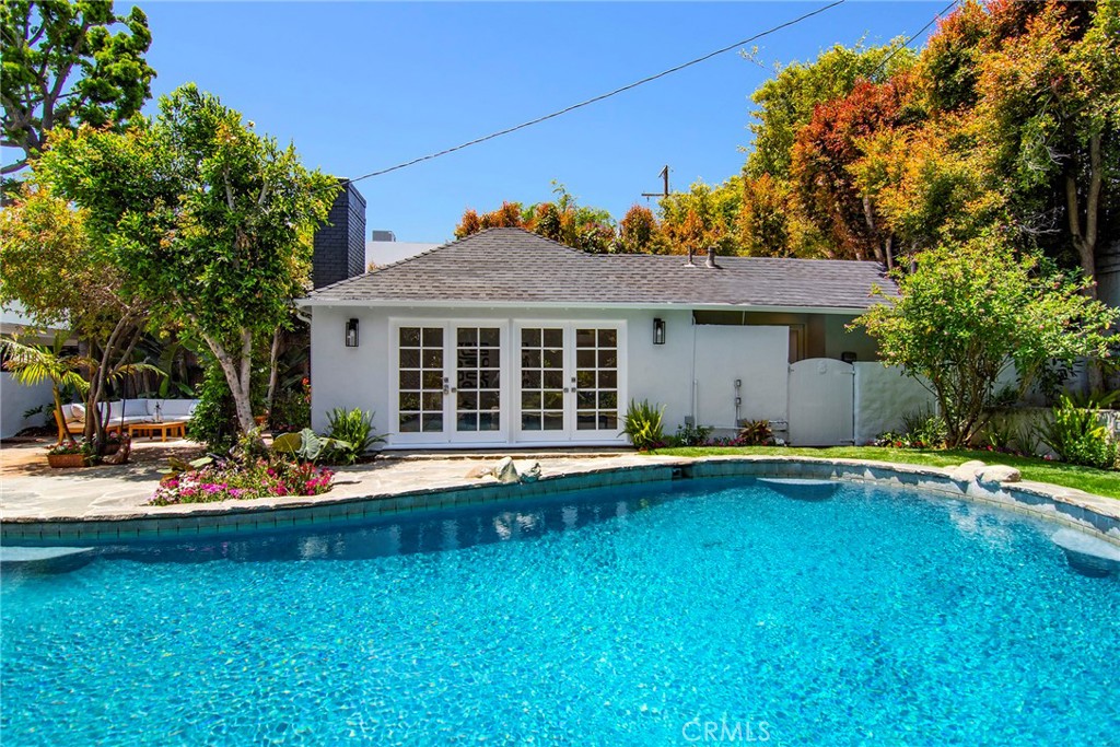 12427 Sunset Boulevard Los Angeles, CA 90049 - Photo 50 of 58 a front view of a house with swimming pool having outdoor seating