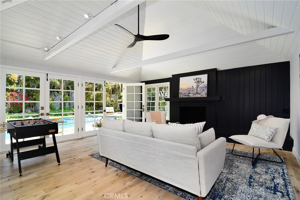 12427 Sunset Boulevard Los Angeles, CA 90049 - Photo 51 of 58 a living room with furniture and a large window