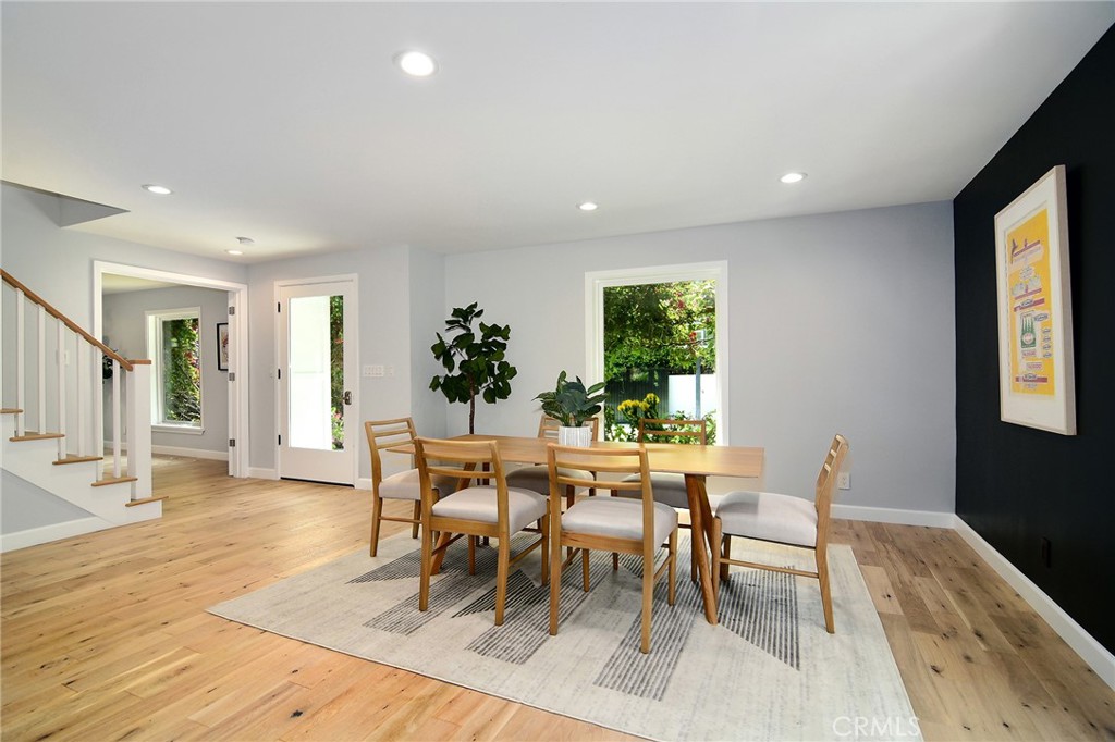 12427 Sunset Boulevard Los Angeles, CA 90049 - Photo 8 of 58 a dining room with furniture and wooden floor
