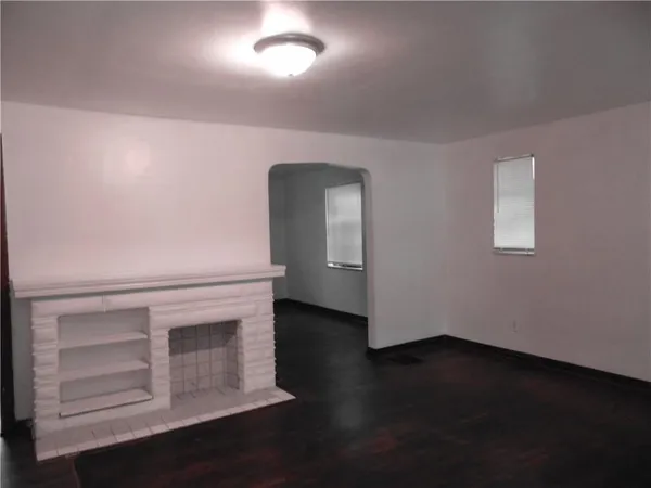 a view of a livingroom with wooden floor