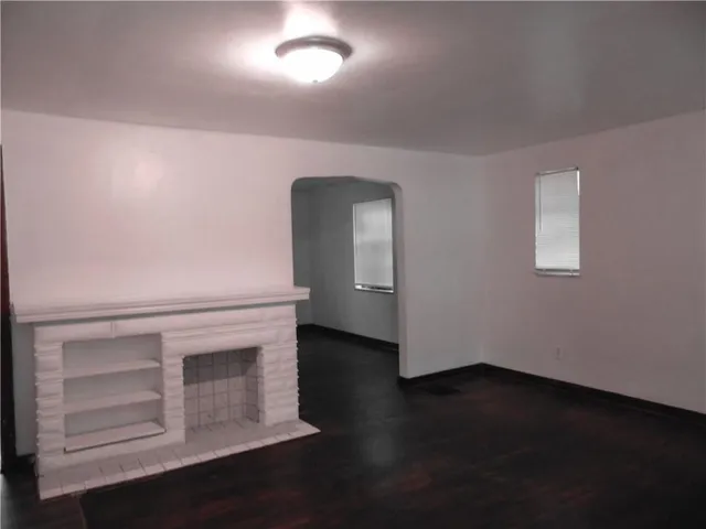 a view of a livingroom with wooden floor