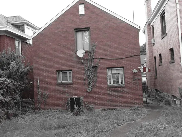 a brick building with a large windows