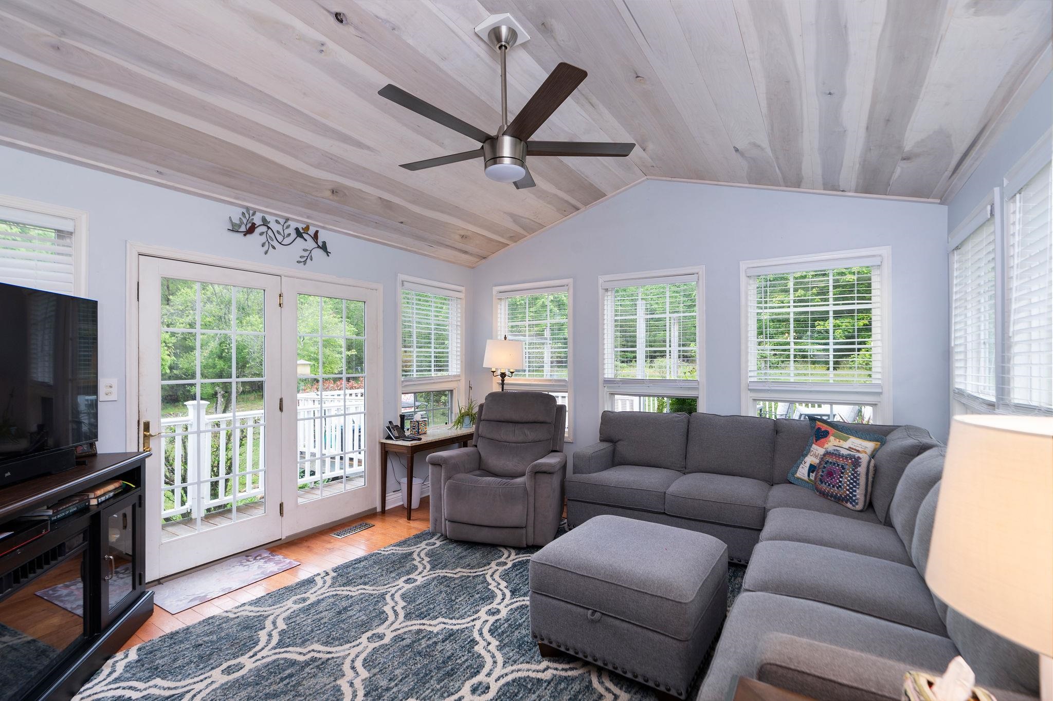 516 Estaline Valley Road Craigsville, VA 24430 - Photo 15 of 75 a living room with furniture a ceiling fan and a window