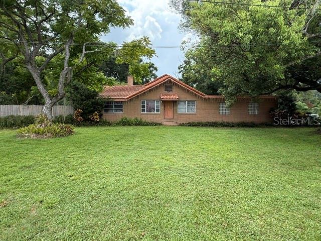 3011 South Wiggins Road Plant City, FL 33566 - Photo 1 of 17 a white house that has a tree in front of it