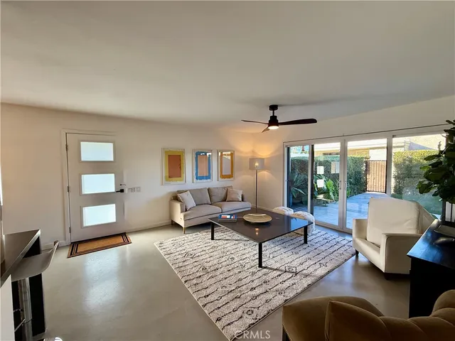 a large kitchen with stainless steel appliances a large window and a counter top space