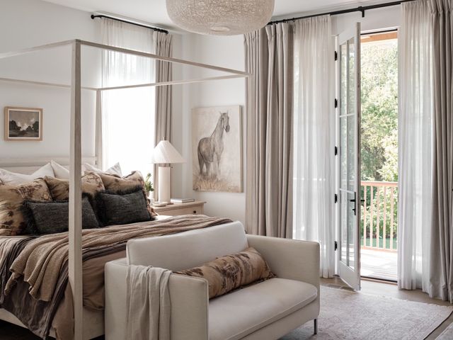 a bedroom with a bed and a couch