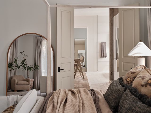 a spacious bathroom with a double vanity sink and a mirror