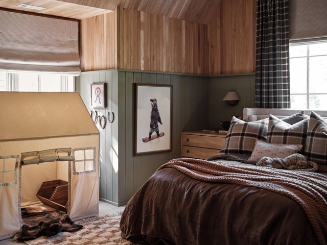 a view of kitchen with wooden cabinets