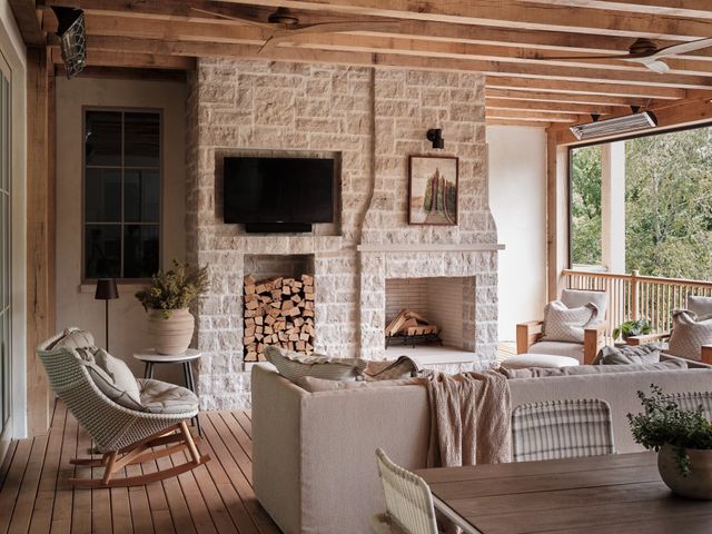 a living room with furniture fireplace and flat screen tv