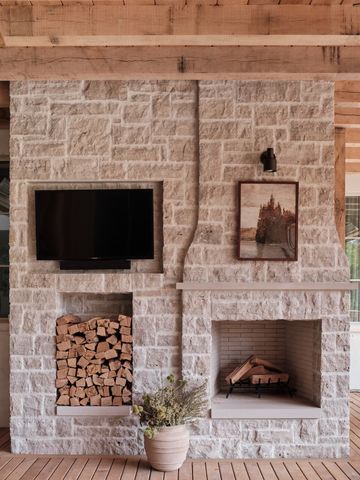 a living room with a fireplace and a fireplace